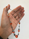 Orange glass and chromium plate machine age 1930s articulated bead necklace