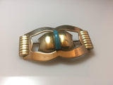 Machine age 1930s vintage two tone Art Deco metal brooch or pin with central blue galalith detail