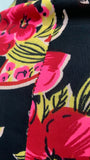 vibrant vintage c.1940  tropical flower print on black ground jersey rayon skirt