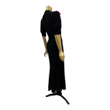 Late 1930s black bias cut crepe evening or dinner dress with cerise cyclamen corsage