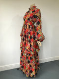 1970s vintage Angela Gore tiered maxi dress with balloon sleeves