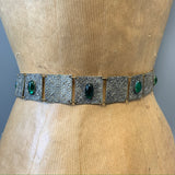 Victorian revival pressed filigree style metal belt with green glass foil backed cabochons