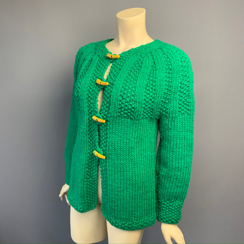 Vintage 1970s green cable detailed chunky knit cardigan with Bakelite toggles