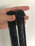 Matched pair of antique French jet or black glass beaded tassel trims