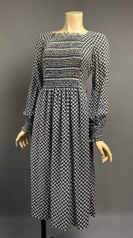 Beautifully made 1970s vintage honeycomb smocked autumn/winter day dress