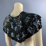 Late 20s to 30s asymmetric point backed heavily sequinned shoulder cape