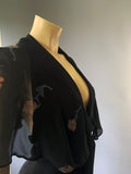 1970s boutique era vintage crepe plunge front Paul Nicholas jumpsuit with floral chiffon